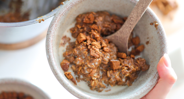 hand holding bowl of oatmeal