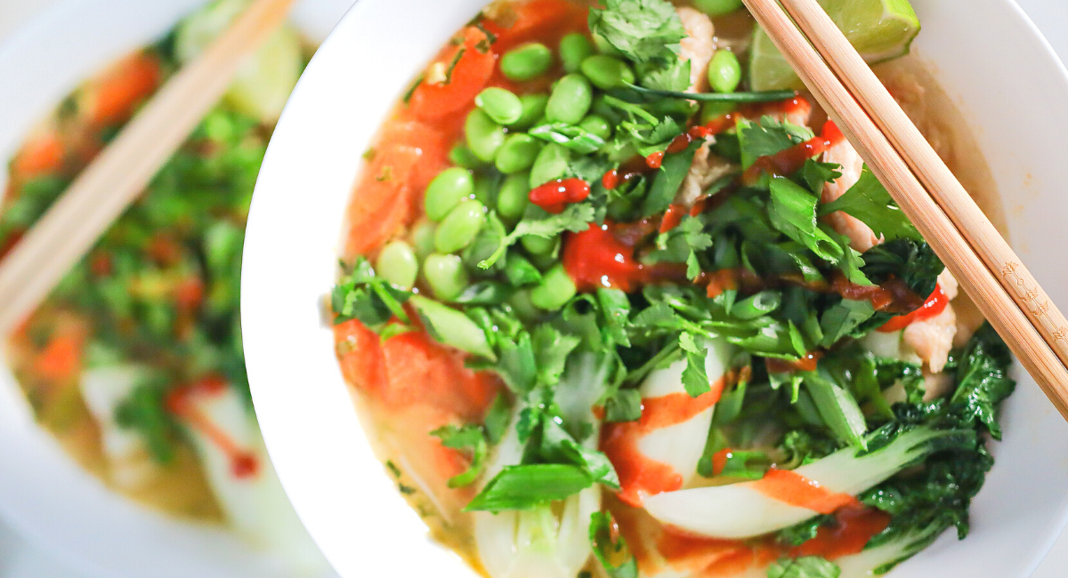 large bowl of noodle soup with vegetables