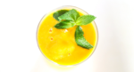 glass with orange drink inside