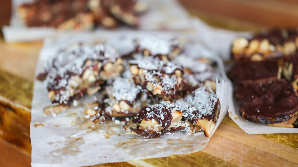 Chocolate date bark (dessert with ayers of dates, nut butter, nuts and chocolate)