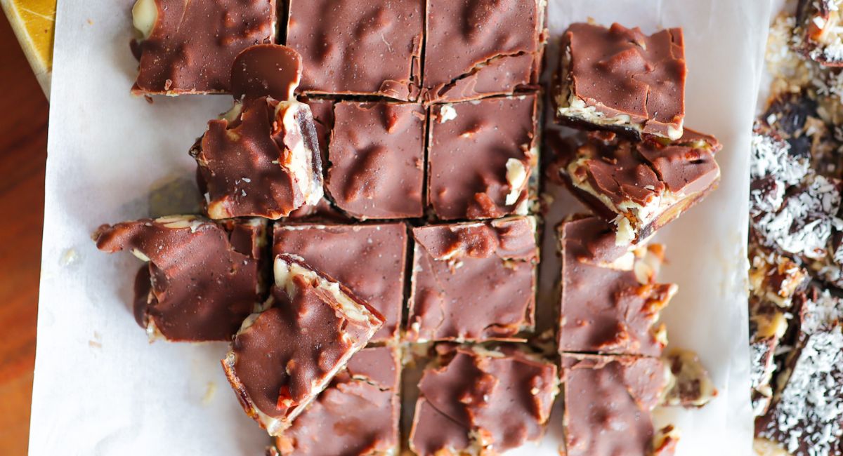 Chocolate date bark (dessert with ayers of dates, nut butter, nuts and chocolate)